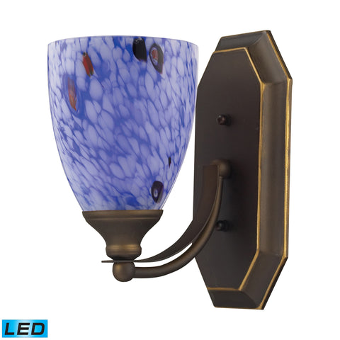 1 Light Vanity In Aged Bronze And Starburst Blue Glass - LED Offering Up To 800 Lumens (60 Watt Equivalent) With Full Range Dimming. Includes An Easily Replaceable LED Bulb (120V).